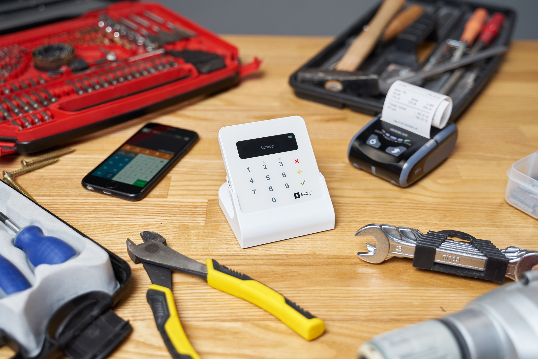 Cash register and cellphone among tools and tacks