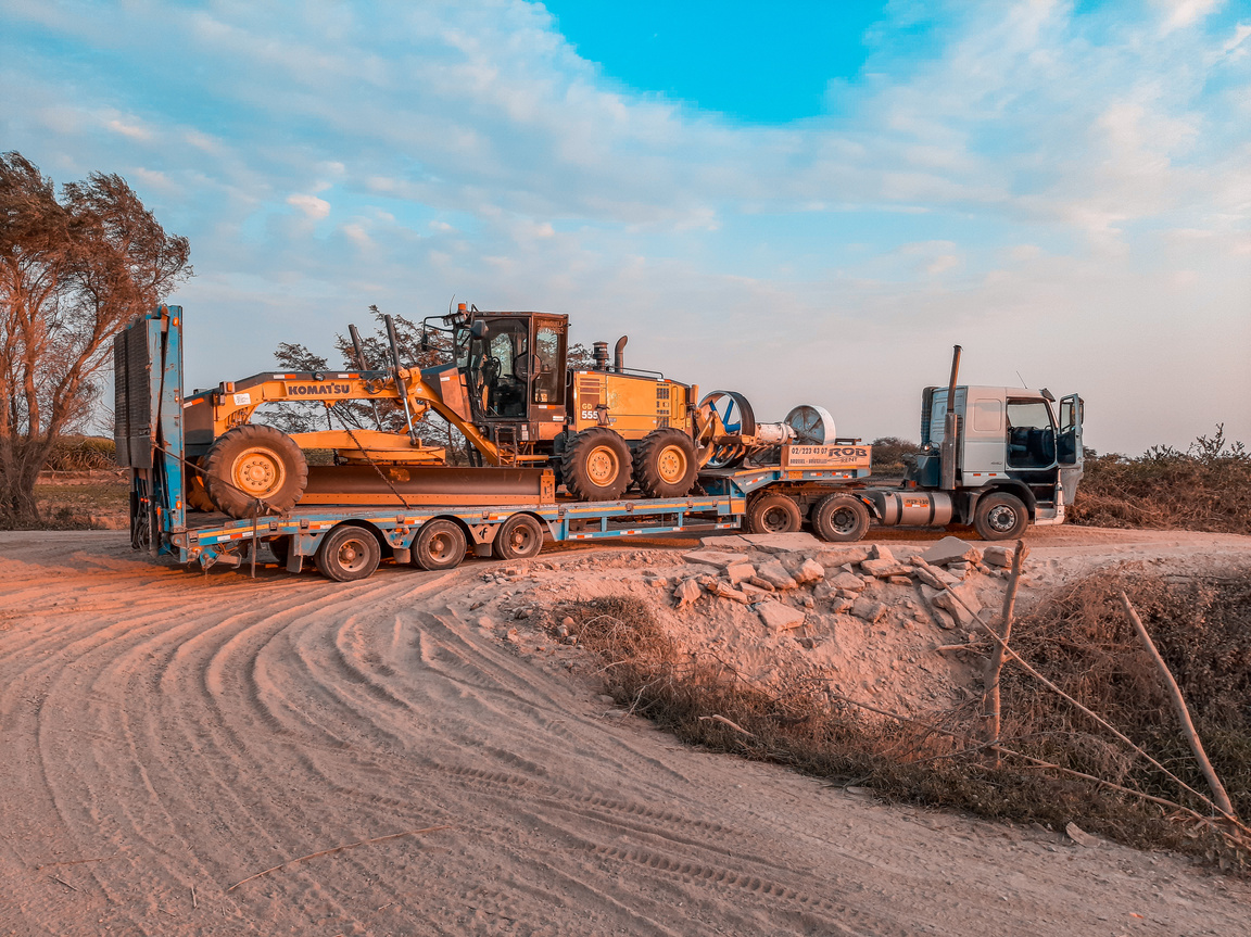 Cargo Truck Transporting a Heavy Machinery